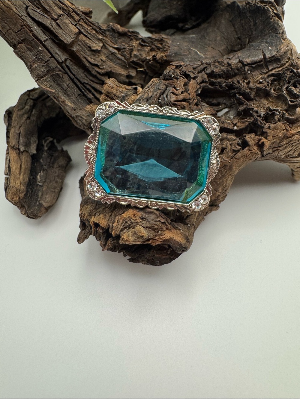 1928 vintage blue acrylic, clear rhinestone and silver-tone metal brooch, EUC.